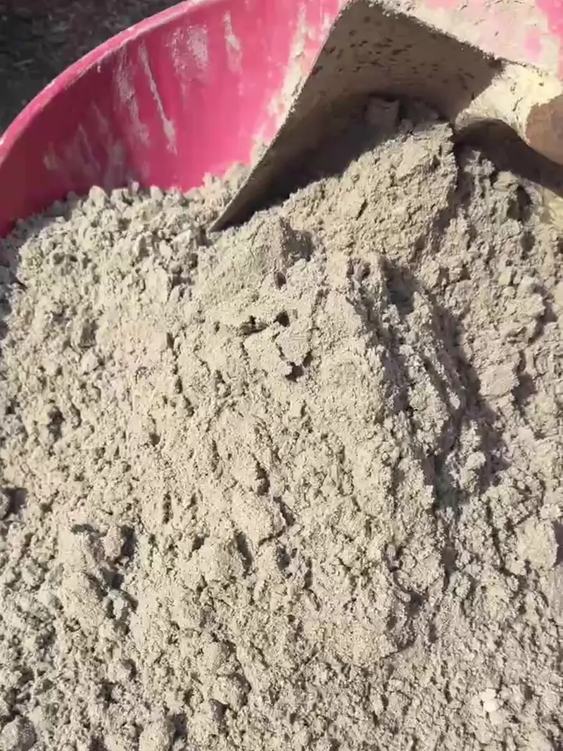 Wheelbarrow of topsoil with a shovel