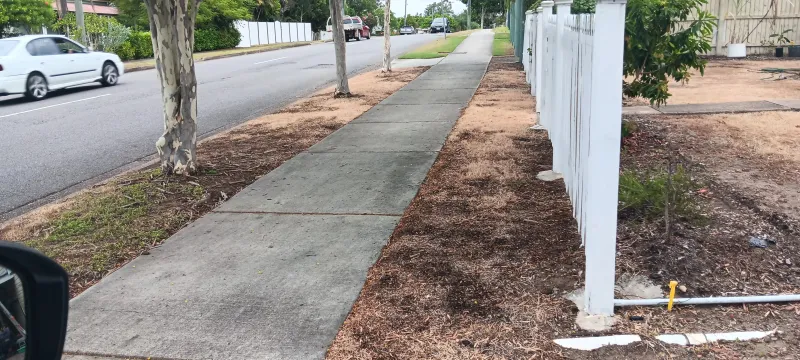 Footpath strip after flame torch treatment showing completely dead vegetation and bare soil